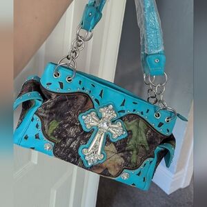 Beautiful cowgirl/Western shoulder bag. NWOT, has beautiful metal pieces.